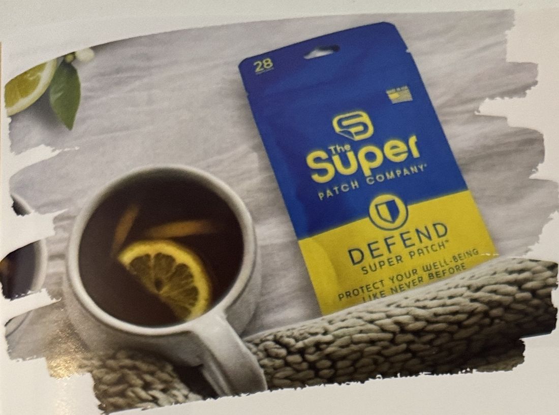 Defend-Packung neben einer Tasse Tee mit Zitrone